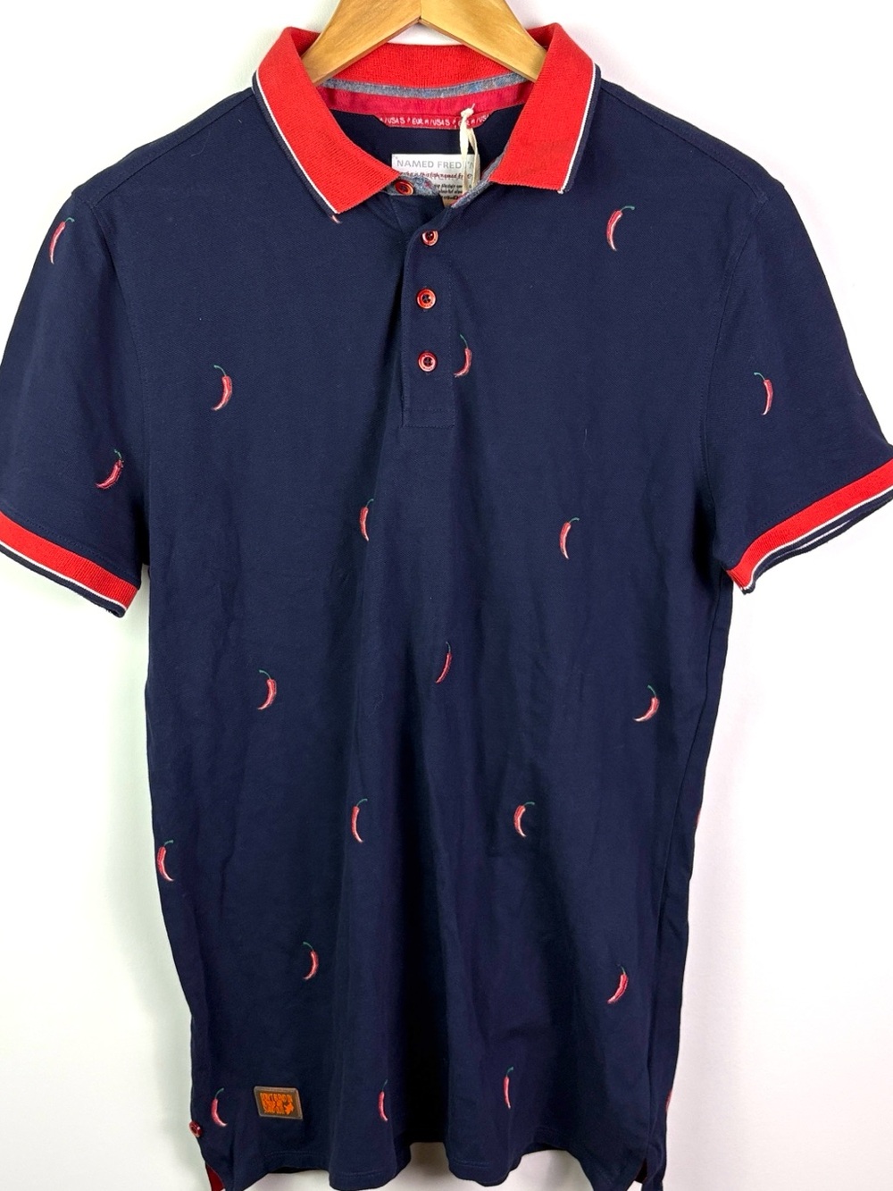 NWT A Fish Named Fred Navy Polo Shirt with Red chilli peppers size S